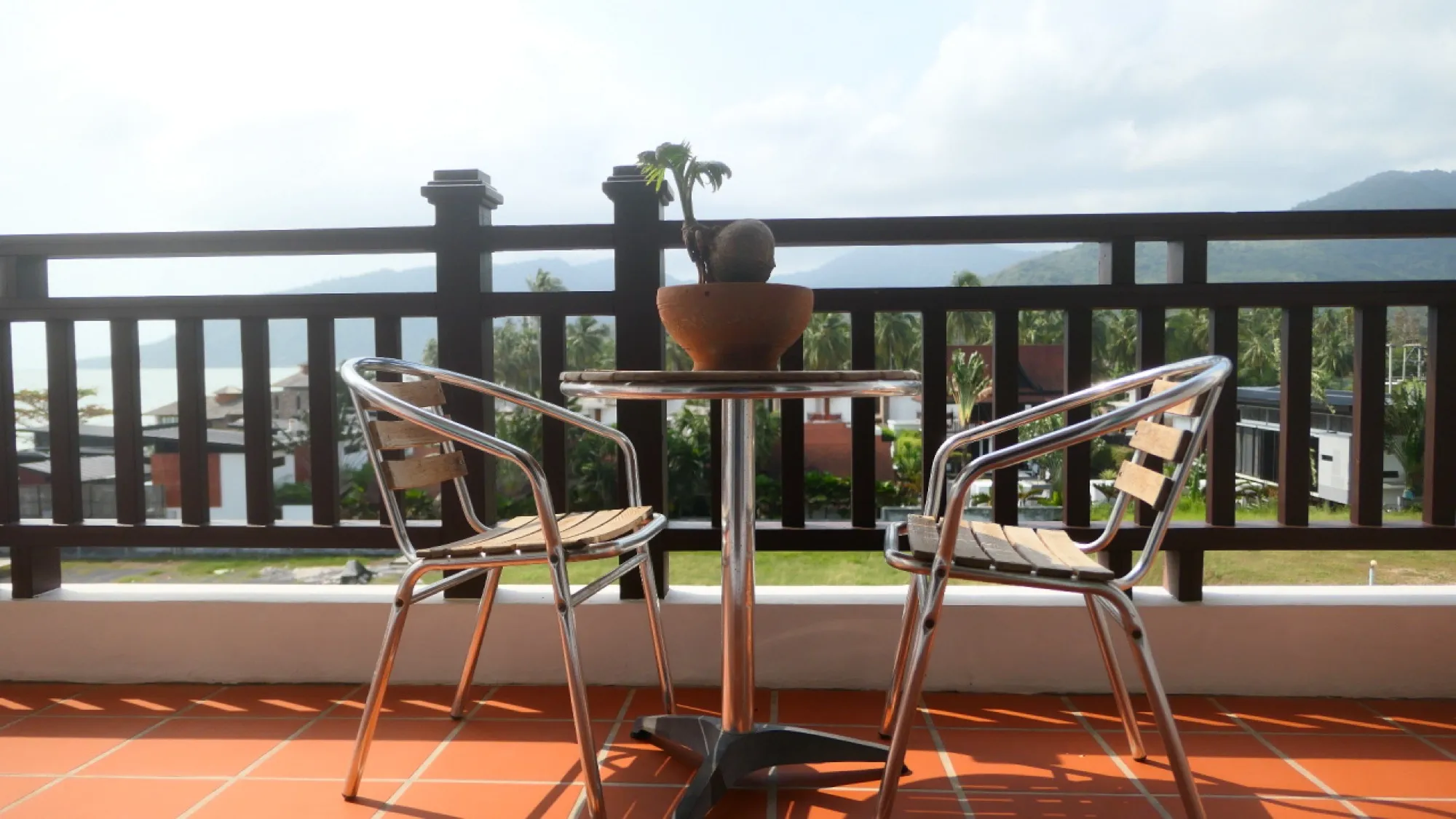 Corner balcony with the gulf on one side and hills on the other