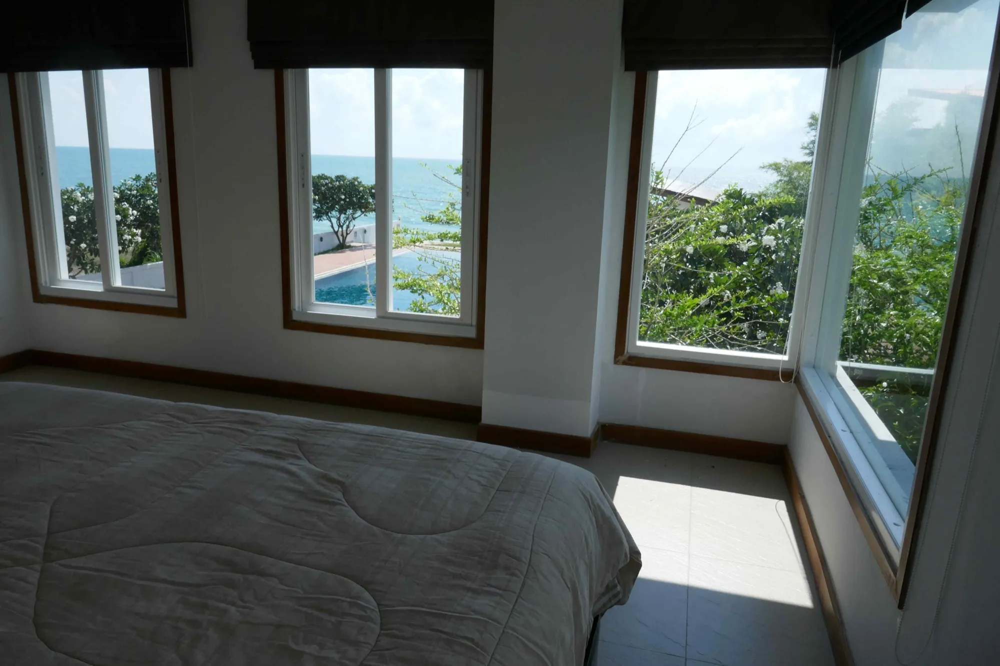 Bed with the Gulf seen through the bedroom windows