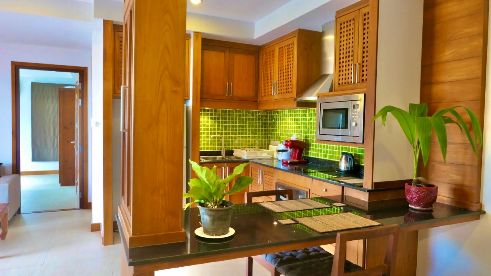 Kitchen with a gas hob and wooden shelves